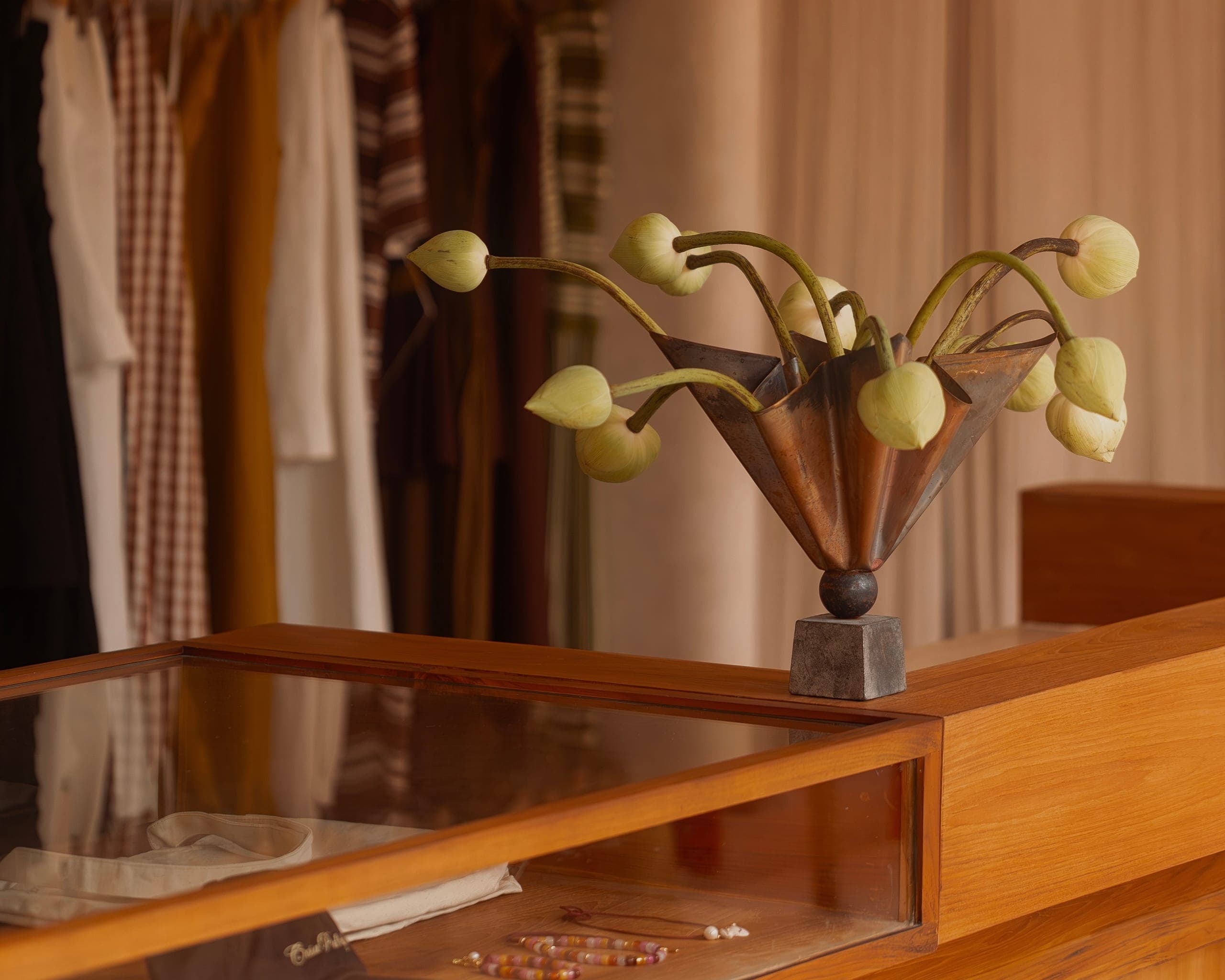 Studio detail, bronze vessel with lotus buds in the Romina Baldomir Studio showroom